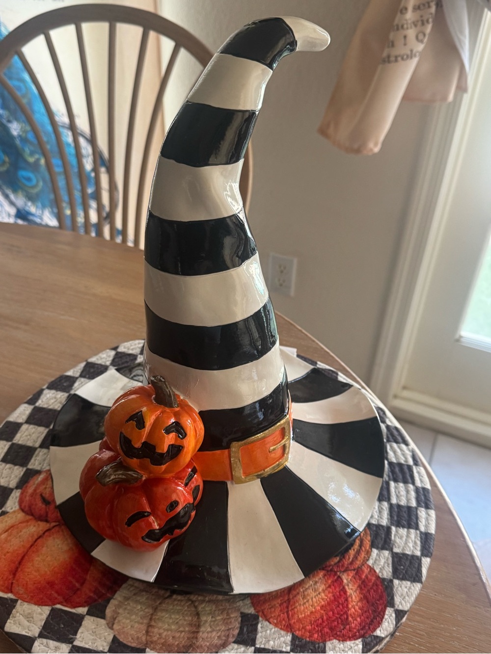 Black & White Striped Witch Hat Halloween Accent with Orange Pumpkin table